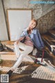 a woman sitting on the steps of a building