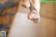 A close up of a person's feet on a yoga mat.