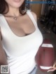 A woman holding a football in her hand.