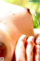 A close up of a person's hand with water coming out of it.